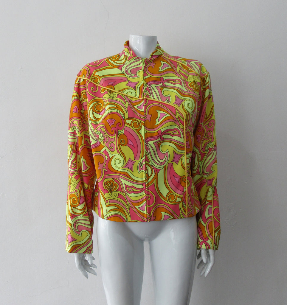 Bright Yellow Print Jacket. Bright loose fitting zippered jacket with 60's style yellow, pink and orange design. Chinese style piping trim accent in yellow satin piping.  Fully lined. 100% Viscose. Lining: 100% Rayon, Dry Clean Only. Made in Canada, 240g approximate weight