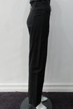 Fully tailored black slightly stretch trouser. Low-cut waist with side pockets above paneled seam. Size 8. Inseam 81.5cm, Outseam 100cm