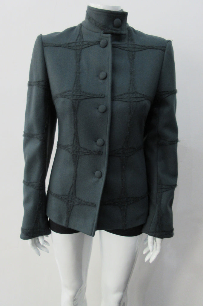 Wobbler Jacket. Tailored jacket with button collar and covered buttons in deep taupe grey, with a slight military feel. Features neo-classical trim design which naturally becomes fuzzy over time as a design detail. Size 8