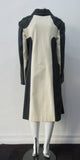 Full length coat featuring charcoal and white contrast panels. 5 covered buttons on centre front.