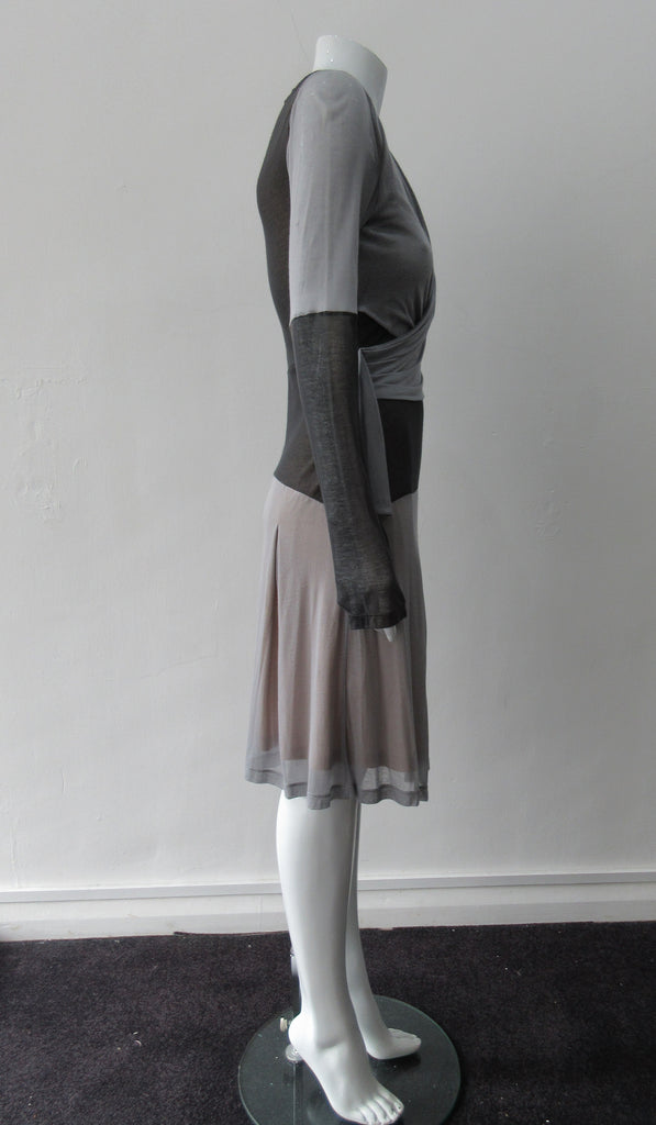 Double Fold Dress. Roman style pleat fold dress in very comfortable soft jersey. Soft grey with Chocolate Brown contrast panels. Long sleeved, side invisible zipper. CB Length 96.5cm, Sleeve Length 73cm. 400g approximtate weight. 100% Modal, Dry Clean Only, Made in England