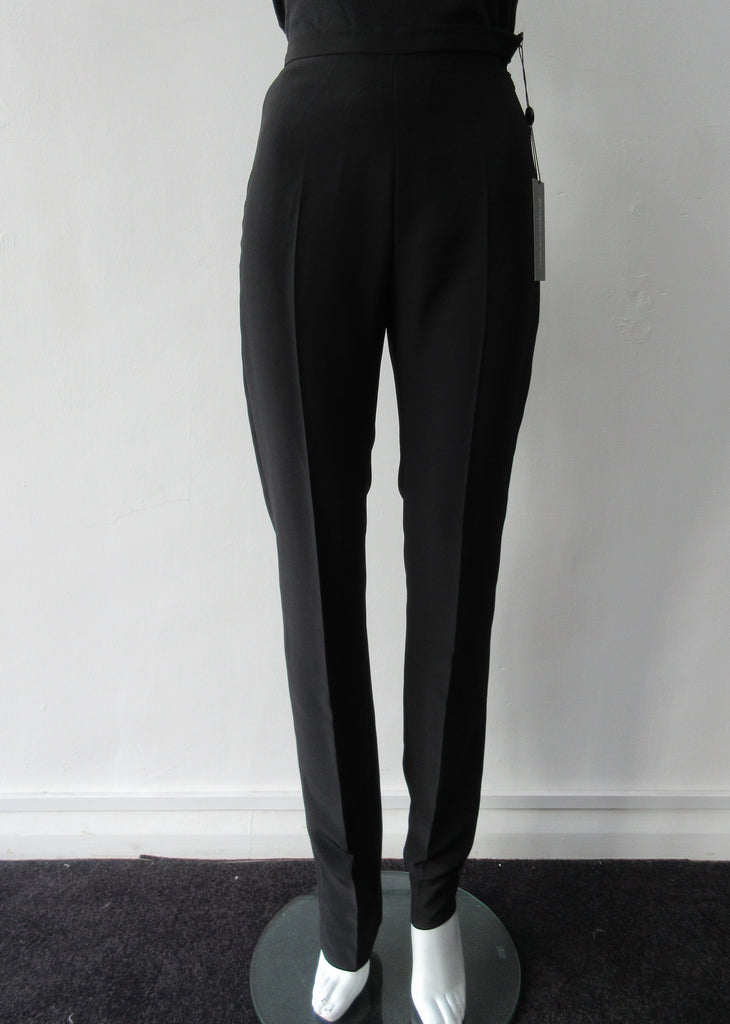 Higher waisted black trouer with tight waist and tapered hems. Contrast print inside waistband. 100% Poyester Crepe Contrast: 100% Silk Dry Clean Only. Exceptional tight fit with small raised waist, more suitable for a very slender figure. Size 6 or XS, Inseam 88cm