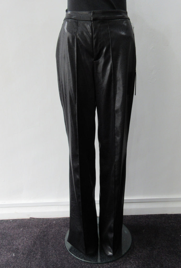 Shiny PVC style looser cut trouser with curved back panel. Extra long legs good for taller person. In black colour. Size 10, Inseam 86cm, Outseam 118cm. 73% Acrylic, 22% Nylon, 3% Elastine Lining, 100% Nylon Dry Clean Only, Made in England