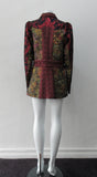 Collared Top  Multi-Combined textured fabric in brass, purlple brocade and red floral for sleeves.  CF buttons in shiny quartz-like glass and large Peter Pan style collar  CB jacket length 71cm 250g approximate weight  65% Cotton, 35% Polyester Contrast: 60% Acetate, 28% Polyester, 12% Polyamide Dry Clean Only. Made in England
