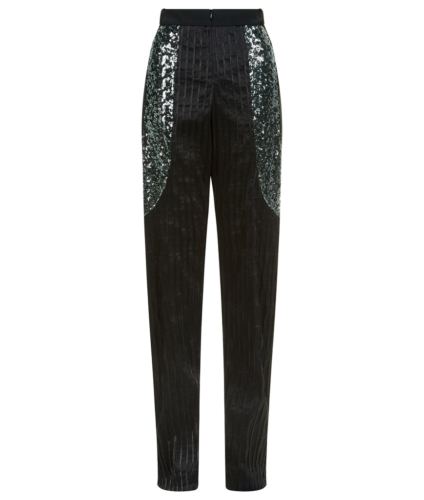 Stretch Sparkle Trouser. Black semi-tailored trouser in combination of stretch stripe & scuba with bold sequin paneling on side hips. CF invisible zipper, no side pockets. Inseam 90cm, Outseam 115cm. 400g approximate weight. 40% Polyamide, 29% Linen, 26% Polyester, 5% Elastine. Contrast: 100% Polyamide. Lining: 100% Viscose. Dry Clean Only. Made in England
