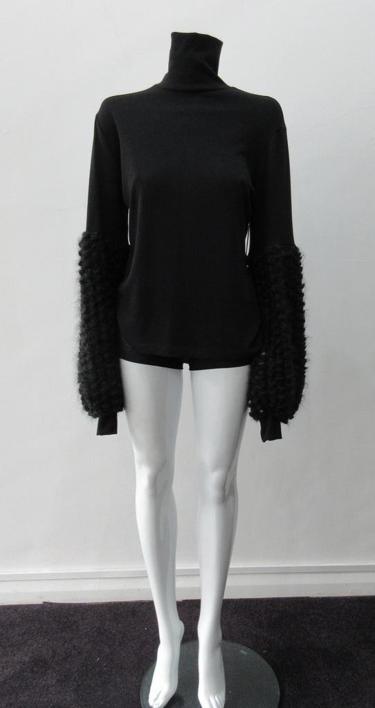 Fluffy Sleeve Top. Extremely soft Cotton/Lycra knit top with 11.5cm high collar. Soft curly sleeve contrast below elbow to cuffs. CB length from neckpoint 64cm. 210g approximate weight. 96% Cotton, 2% Lycra. Contrast 100% Viscose. Dry Clean Only. Made in Canada