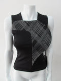 Assymetrical Plaid Front Top. Sleeveless crop top with plaid contrast panel extension can be flipped to right or left. Solid black bodice with grey tatran plaid panel. CB length 51cm, 300g approximate weight. 97% Cotton, 3% Lycra. Contrast: 63% Polyster, 33% Rayon, 4% Sapndex Lining: 100% Viscose