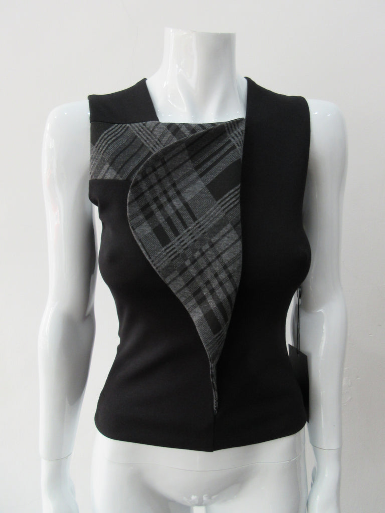 Assymetrical Plaid Front Top. Sleeveless crop top with plaid contrast panel extension can be flipped to right or left. Solid black bodice with grey tatran plaid panel. CB length 51cm, 300g approximate weight. 97% Cotton, 3% Lycra. Contrast: 63% Polyster, 33% Rayon, 4% Sapndex Lining: 100% Viscose