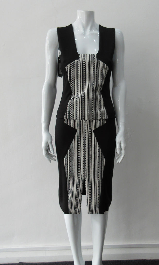 Black & White Top. Black sleeveless jersey stretch crop top with black & white cotton stripe contrast panel. CB length 63cm. 450g approximate weight. 97% Cotton, 3% Lycra. Contrast: 94% Cotton, 6% Polyester. Lining: 100% Viscose. Dry Clean Only. Made in Canada