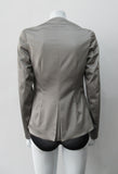 Corset Jacket. Geometric cut lower front metal zip jacket with flared peplum-style hem in medium length. Designed for a tighter fit around the bust area. In solid silver taupe colour with slight stretch. CB length 63cm. Sleeve length from side neck point 78cm. 750g approximate weight. 95% Polyester, 5% Spandex. Lining: 100% Viscose. Dry Clean Only. Made in England