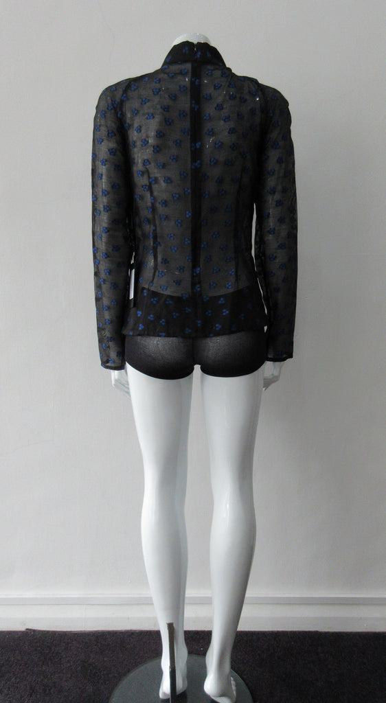 Dark Gathered Top, Generously gathered long sleve top in sheer black with tri-blue dot design. CB zipper and under bust panel trim. 2 invisible side zippers at side seam bottom. Can be paired with 180608D Dark Curve Front Pencil Skirt, CB length 60cm. 50g approximate weight 48% Polyester, 34% Cotton, 18% Nylon. Dry Clean Only. Made in England