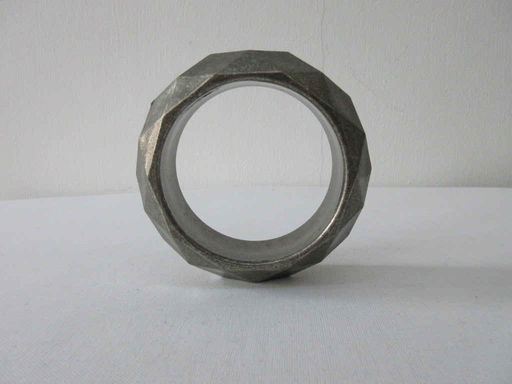Angle style Bangle with dimond shape design unknown metal, probably Aluminium 1.5cm thickness, 6.5cm inside diameter