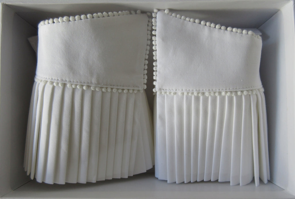 Catherine Osti White Pleated Cuffs 100% Cotton. Textured white, similar to dress shirt trim. Micro cotton ball trim on side and bottom. Snap Closure. Size M -18cm width from snap to snap Size L -20cm width from snap to snap, 60g approximate weight, comes in white box. Made in France