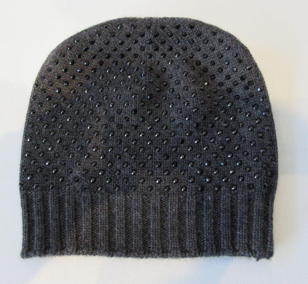 Regina Charcoal Dark Crystal Hat. Knit Cap in Charcoal with mini Swarowski crystals on front. Crystals can be displayed full front or worn sideways. Article 90717 TG A/M. Width 22cm, Height 21cm. 50g approximate weight. 100% Wool Hand wash, Hang dry only. Made in Italy
