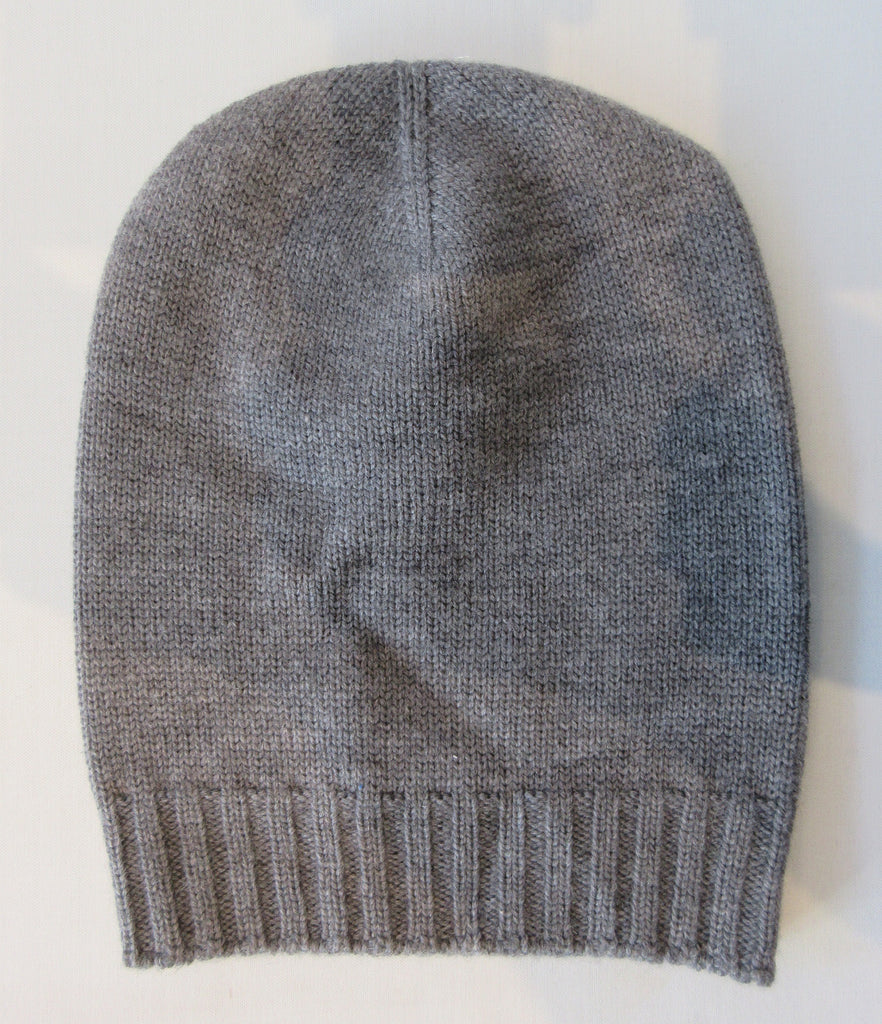 Regina Grey Silver Crystal Hat. Knit Cap in Medium Grey with silver mini Swarowski crystals on front.  Crystals can be displayed full front or worn sideways. Article 90733 Fumo TG A/M. Width 22cm, Height 21cm. 50g approximate weight. 100% Wool Hand wash, Hang dry only. Made in Italy