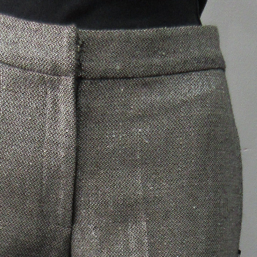 Soft micro-tweed with slight shine. 53% Wool, 31% Viscose, 14% Silk, 2% Polyeurathane. Size 8, Inseam 82.5cm, Outseam 102cm, Dry Clean Only,  Made in England.